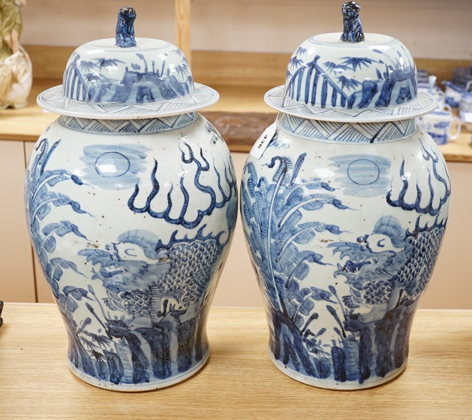A pair of large Chinese blue and white ginger jars and covers, 54cm high. Condition - fair to , good